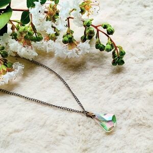 Vintage teardrop shaped prism cut crystal pendant on original silver chain